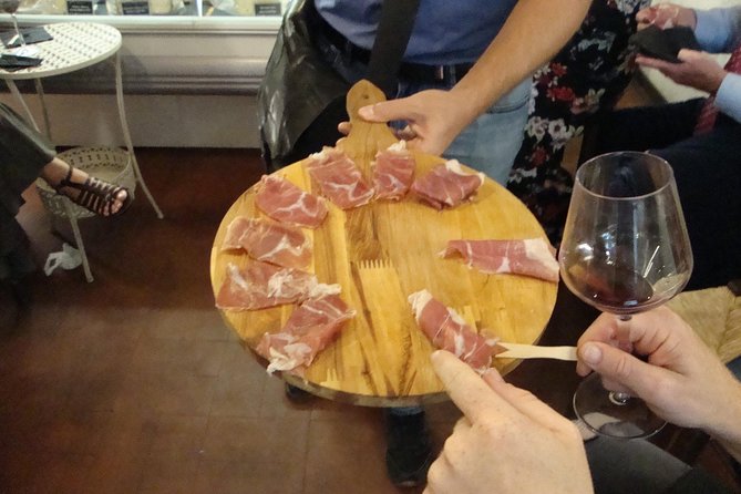 Evening food & wine tour in Rome's historical center - Campo de’ Fiori alimentari: cheese, cured meats, and organic Roman wine