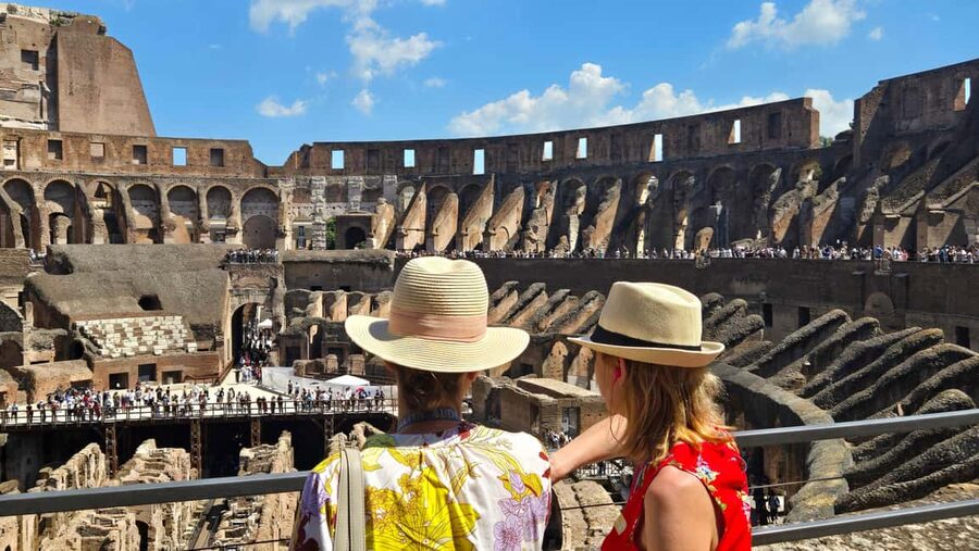 Rome: Colosseum Express Tour and Roman Forum Access - Entering the Colosseum with headsets and a licensed English guide