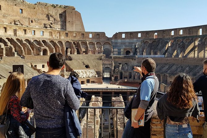 Rome: Colosseum, Palatine Hill and Roman Forum Guided Tour - Down Into the Forum Valley: Basilica, Doors, and the Temple Zone