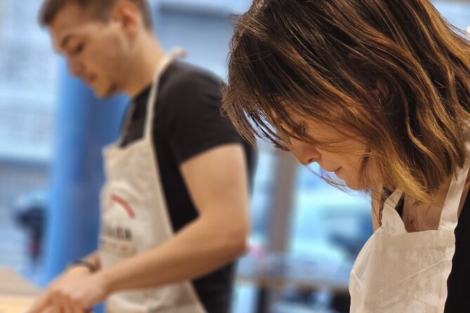 Rome: Hands-on Fettuccine, Ravioli & Tiramisu Cooking Class - Eating your pasta and tiramisu at a shared table