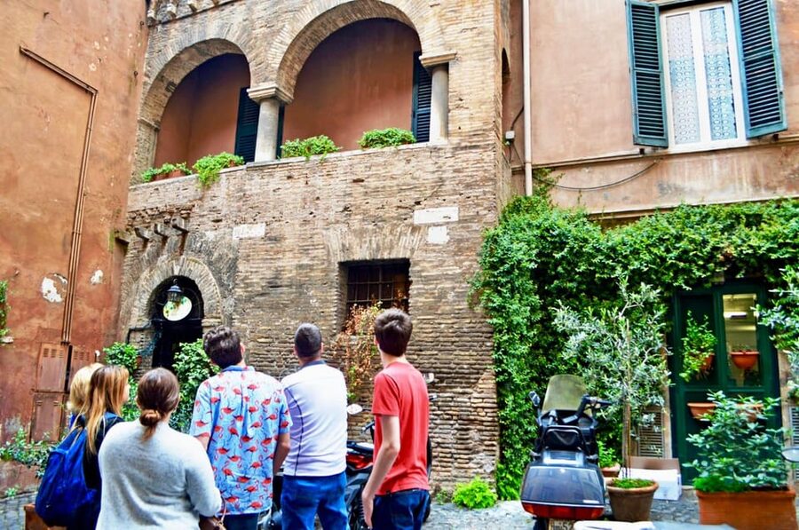 Rome: Trastevere & Tiber Island Street Food Tour at Sunset - Trastevere on cobblestones, with Santa Maria and Piazza Trilussa in view