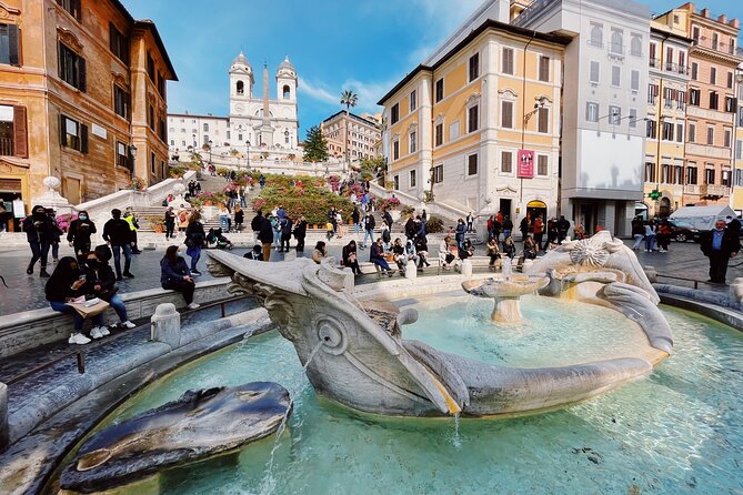 Trevi Fountain Underground Aqueduct and Spanish Steps Tour - The column near Piazza di Spagna, and a reminder about Roman traditions