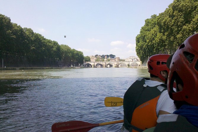 Urban Rafting on Rome's Tiber River - Safety setup on the Tiber: helmets, life jackets, and a waterproof bag