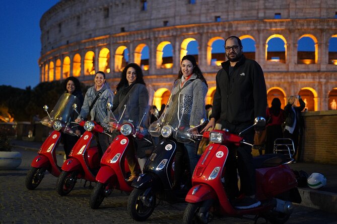 Vespa Scooter Night Tour in Rome with Professional Photographer - The Colosseum, lit up like a night show